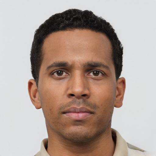 Neutral black young-adult male with short  black hair and brown eyes