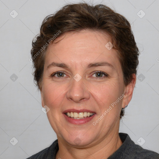 Joyful white adult female with short  brown hair and brown eyes