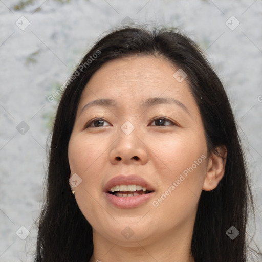 Joyful asian young-adult female with long  brown hair and brown eyes