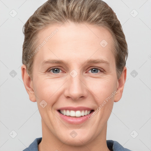 Joyful white young-adult female with short  brown hair and grey eyes