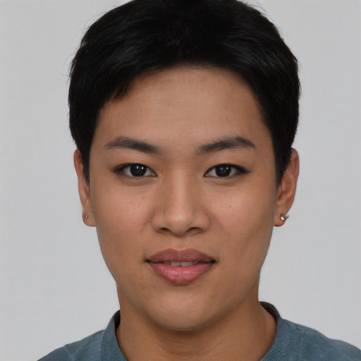 Joyful asian young-adult female with short  black hair and brown eyes