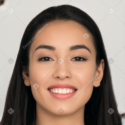 Joyful latino young-adult female with long  black hair and brown eyes