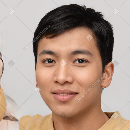 Joyful asian young-adult male with short  black hair and brown eyes