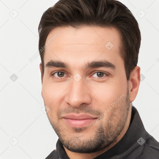 Joyful white young-adult male with short  brown hair and brown eyes