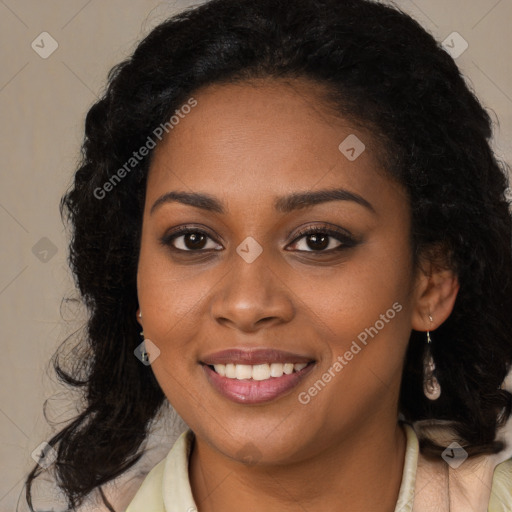 Joyful black young-adult female with long  brown hair and brown eyes