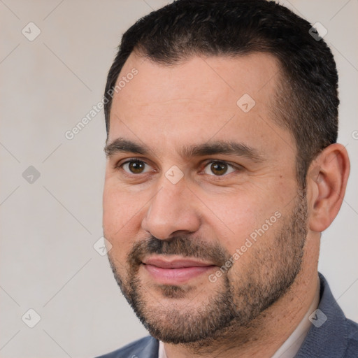 Joyful white adult male with short  brown hair and brown eyes