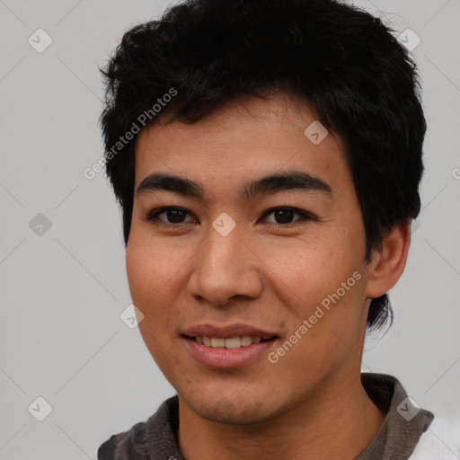 Joyful asian young-adult male with short  black hair and brown eyes