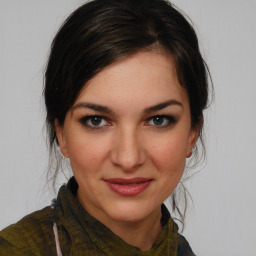 Joyful white young-adult female with medium  brown hair and brown eyes