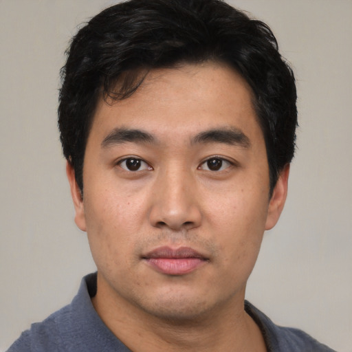 Neutral asian young-adult male with short  black hair and brown eyes