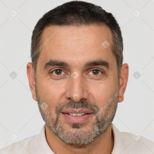 Joyful white adult male with short  brown hair and brown eyes