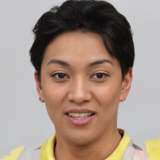 Joyful asian young-adult female with short  black hair and brown eyes