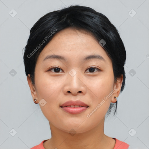 Joyful asian young-adult female with short  black hair and brown eyes