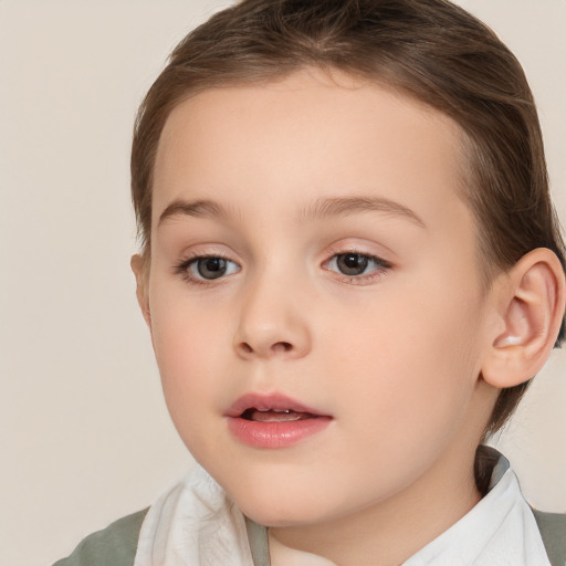 Joyful white child female with medium  brown hair and brown eyes