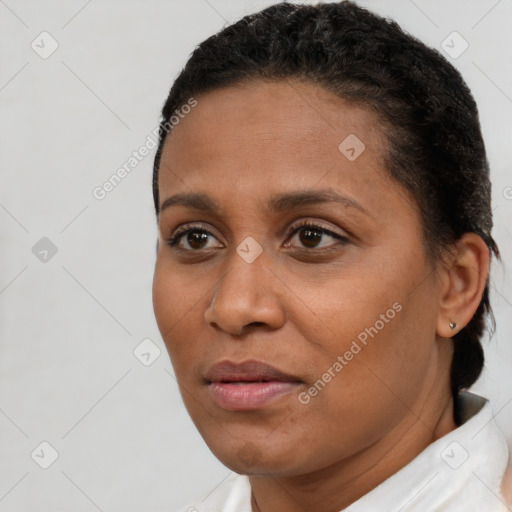 Joyful latino young-adult female with short  brown hair and brown eyes