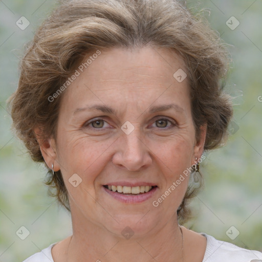 Joyful white adult female with short  brown hair and brown eyes