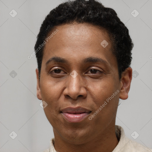 Joyful latino adult male with short  black hair and brown eyes