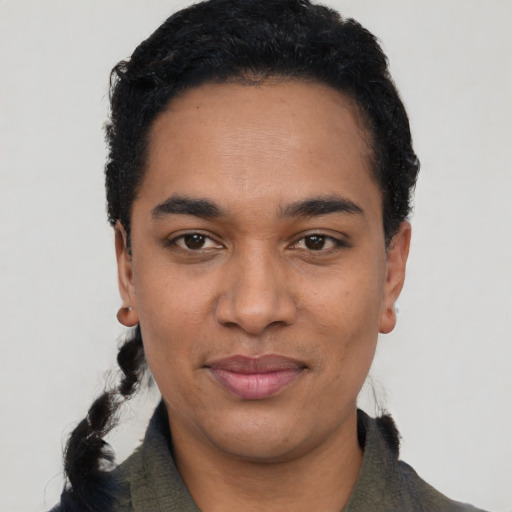 Joyful latino young-adult female with short  black hair and brown eyes