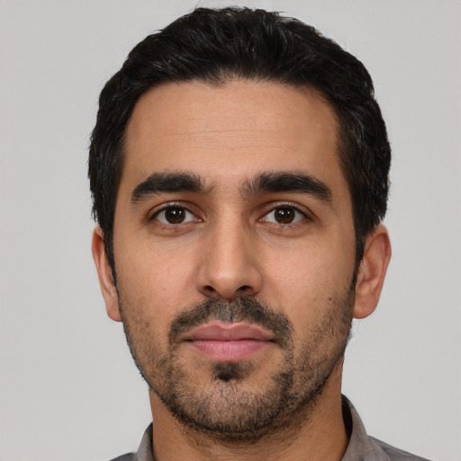 Neutral white young-adult male with short  black hair and brown eyes