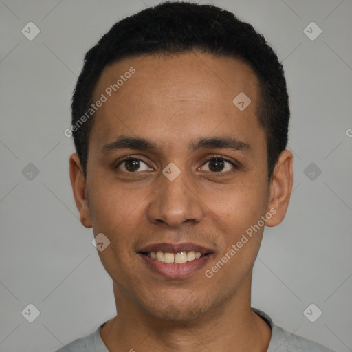 Joyful latino young-adult male with short  black hair and brown eyes