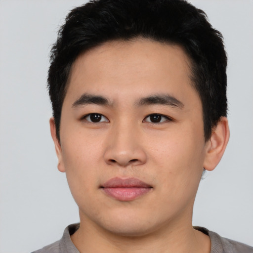Neutral asian young-adult male with short  black hair and brown eyes