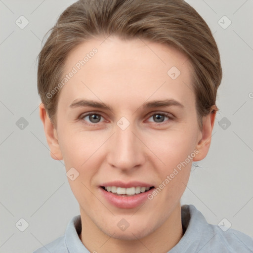 Joyful white young-adult female with short  brown hair and grey eyes