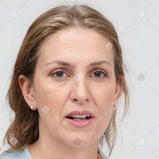 Joyful white adult female with medium  brown hair and grey eyes