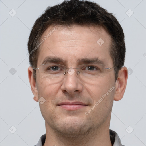 Joyful white adult male with short  brown hair and brown eyes