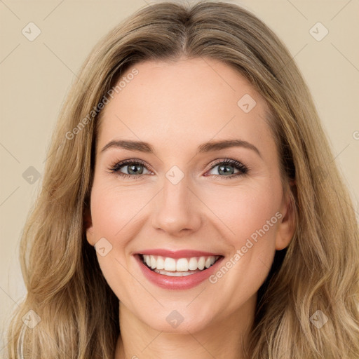 Joyful white young-adult female with long  brown hair and green eyes