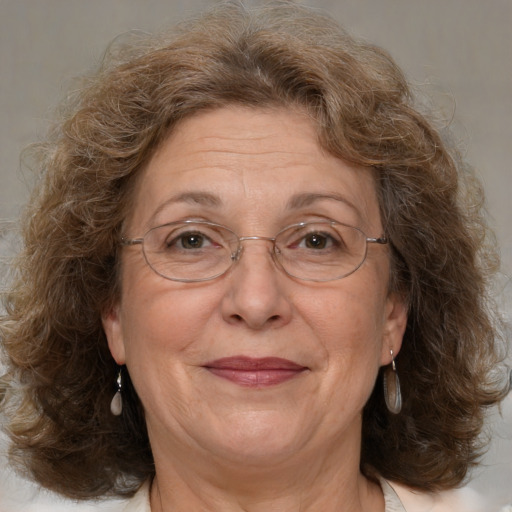 Joyful white middle-aged female with medium  brown hair and brown eyes