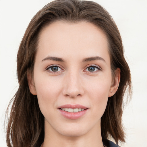 Joyful white young-adult female with long  brown hair and blue eyes