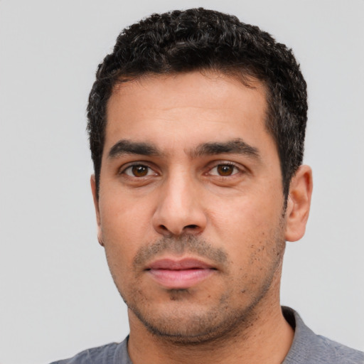 Neutral white young-adult male with short  black hair and brown eyes