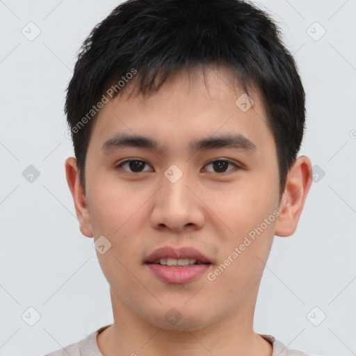 Joyful asian young-adult male with short  brown hair and brown eyes