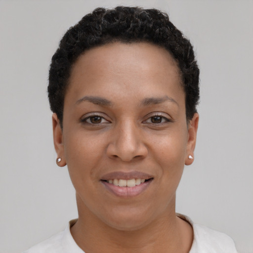 Joyful latino young-adult female with short  black hair and brown eyes