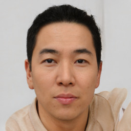 Neutral asian young-adult male with short  brown hair and brown eyes