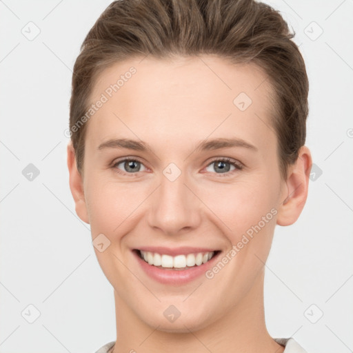 Joyful white young-adult female with short  brown hair and grey eyes