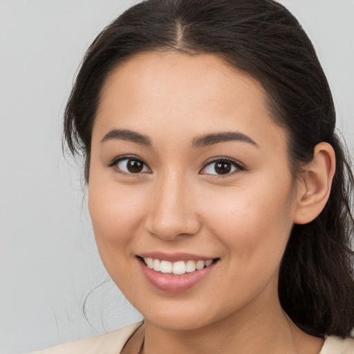 Joyful white young-adult female with medium  brown hair and brown eyes