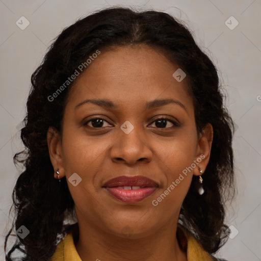 Joyful black young-adult female with medium  brown hair and brown eyes