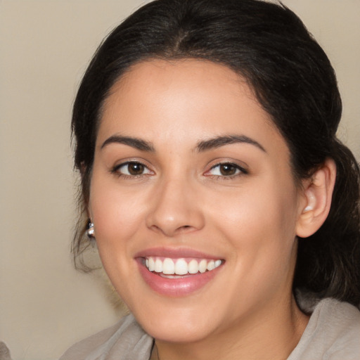 Joyful white young-adult female with medium  brown hair and brown eyes