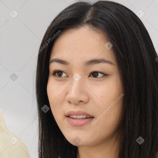 Joyful asian young-adult female with long  brown hair and brown eyes