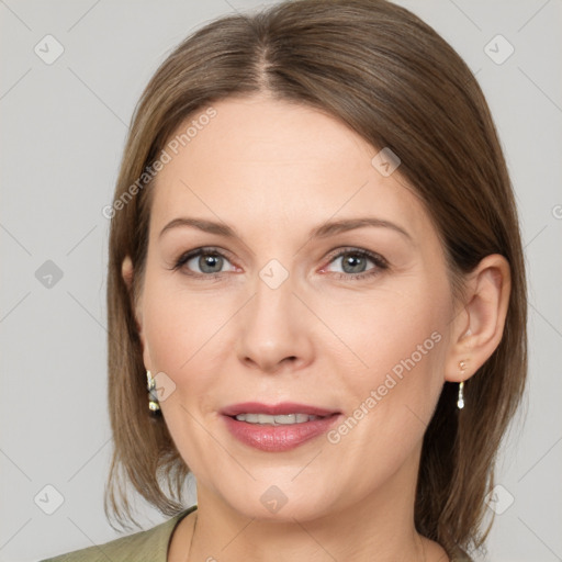 Joyful white adult female with medium  brown hair and grey eyes