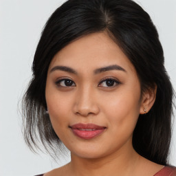 Joyful asian young-adult female with medium  brown hair and brown eyes