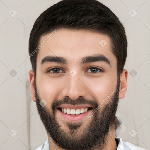 Joyful white young-adult male with short  black hair and brown eyes