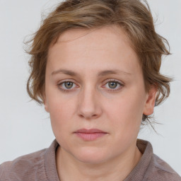 Neutral white young-adult female with medium  brown hair and blue eyes