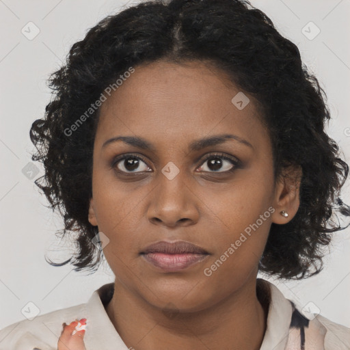 Joyful black young-adult female with long  black hair and brown eyes