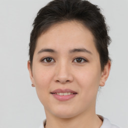 Joyful asian young-adult female with short  brown hair and brown eyes