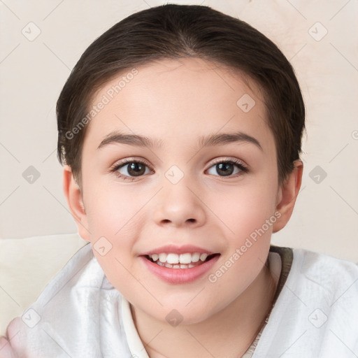 Joyful white child female with short  brown hair and brown eyes