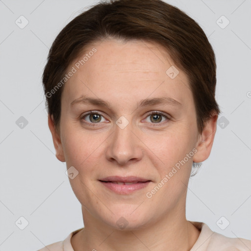 Joyful white young-adult female with short  brown hair and grey eyes