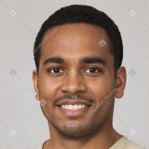 Joyful black young-adult male with short  black hair and brown eyes