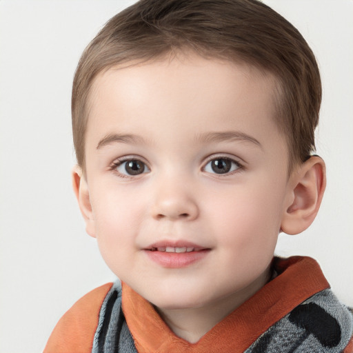 Joyful white child male with short  brown hair and grey eyes