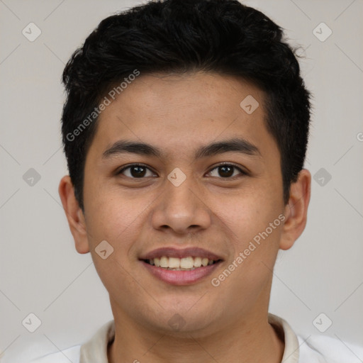 Joyful latino young-adult male with short  brown hair and brown eyes